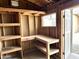 Interior view of the shed, including built-in shelving and a workbench at 1109 E Emerald Ave, Mesa, AZ 85204