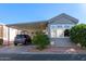 Charming home featuring a covered carport and mature landscaping at 111 S Greenfield Rd # 97, Mesa, AZ 85206