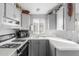 Well-lit kitchen features light countertops and a classic gas range at 111 S Greenfield Rd # 97, Mesa, AZ 85206