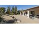 View of the property's backyard patio with well-maintained landscaping and outdoor seating, perfect for relaxation at 11115 E Bellflower Ct, Sun Lakes, AZ 85248