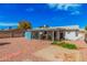 Wide view of backyard, featuring the patio, shed, and low-maintenance desert landscaping at 1117 W Mesquite St, Chandler, AZ 85224