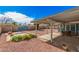 View of the backyard, showcasing the covered patio and desert landscaping at 1117 W Mesquite St, Chandler, AZ 85224