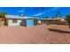 Expansive view of the backyard with low-maintenance desert landscaping and covered patio at 1117 W Mesquite St, Chandler, AZ 85224