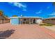 Backyard features a covered patio, a shed, and low-maintenance desert landscaping at 1117 W Mesquite St, Chandler, AZ 85224