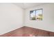 Bright bedroom with wood floors features a window and a neutral color palette at 1117 W Mesquite St, Chandler, AZ 85224