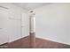 White bedroom features a closet with a door, wood floors and neutral color palette at 1117 W Mesquite St, Chandler, AZ 85224