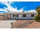 Charming single-story home featuring a covered carport and low-maintenance desert landscaping at 1117 W Mesquite St, Chandler, AZ 85224