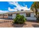 Charming single-story home featuring a covered carport and low-maintenance desert landscaping at 1117 W Mesquite St, Chandler, AZ 85224