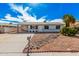 Charming single-story home featuring a covered carport and low-maintenance desert landscaping at 1117 W Mesquite St, Chandler, AZ 85224