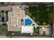 Aerial view of a luxury estate featuring a pool, basketball court, putting green, and lush landscaping at 11222 N 73Rd St, Scottsdale, AZ 85260