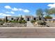 Modern home with a desert-landscaped front yard, featuring a pathway to the front door at 11222 N 73Rd St, Scottsdale, AZ 85260