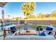 Inviting backyard with a pool, putting green, fire pit, and stylish outdoor seating at 15035 N 54Th St, Scottsdale, AZ 85254