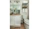 Cozy bathroom featuring updated vanity, neutral color palette, and linen storage at 15035 N 54Th St, Scottsdale, AZ 85254