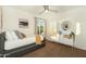 Cozy bedroom filled with natural light, stylish furnishings, and a ceiling fan at 15035 N 54Th St, Scottsdale, AZ 85254