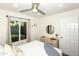 Light-filled bedroom featuring a large window, dresser, and stylish decor at 15035 N 54Th St, Scottsdale, AZ 85254