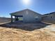 A new backyard featuring a covered patio offers potential for creating your outdoor oasis and entertainment space at 15744 W Beryl Ave, Waddell, AZ 85355