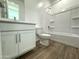 Well lit bathroom featuring a shower and bath combination along with modern wood plank flooring at 15744 W Beryl Ave, Waddell, AZ 85355