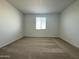 Bedroom with carpeted floors and a window for natural light at 15744 W Beryl Ave, Waddell, AZ 85355