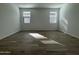 Spacious bedroom with light tile flooring and bright natural light at 15744 W Beryl Ave, Waddell, AZ 85355