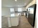 Spacious kitchen with a large island, stainless steel appliances and ample countertop space at 15744 W Beryl Ave, Waddell, AZ 85355