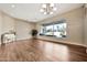 Bright living area with wood floors, piano, and view of the sparkling outdoor pool at 1738 W Yosemite Pl, Chandler, AZ 85248