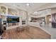 Spacious living room with a fireplace and seamless flow into the kitchen and dining area at 1738 W Yosemite Pl, Chandler, AZ 85248