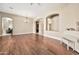 Spacious living room featuring wood floors and arched openings to other living areas at 1738 W Yosemite Pl, Chandler, AZ 85248