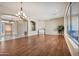 Expansive living room with wood floors and natural light and a separate dining area and foyer at 1738 W Yosemite Pl, Chandler, AZ 85248