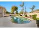 Lush backyard with a sparkling pool, mature landscaping, and a serene ambiance at 1738 W Yosemite Pl, Chandler, AZ 85248