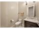 Chic powder room with elegant vanity, marble countertop, and stylish fixtures offers a touch of luxury at 1738 W Yosemite Pl, Chandler, AZ 85248