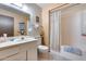 Bathroom featuring a shower-tub combination, a white single sink vanity, and neutral paint at 17428 N Boswell Blvd, Sun City, AZ 85373