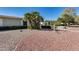 The exterior of this lovely home features manicured landscaping and mature palm trees at 17428 N Boswell Blvd, Sun City, AZ 85373