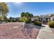 Attractive community featuring well-maintained homes with desert landscaping and paved walkways, with a blue sky above at 17428 N Boswell Blvd, Sun City, AZ 85373