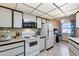 Functional kitchen with white appliances and cabinetry, offering ample counter space and a bright ambiance at 17428 N Boswell Blvd, Sun City, AZ 85373