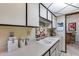 Well-lit kitchen featuring ample counter space, white cabinets, and essential appliances at 17428 N Boswell Blvd, Sun City, AZ 85373