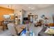 Open-concept living area with comfortable seating, a ceiling fan, and natural light at 17428 N Boswell Blvd, Sun City, AZ 85373