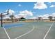 Outdoor basketball court with two hoops offers a fun recreational area for the community at 17580 W Country Club Ter, Surprise, AZ 85387