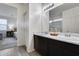 Modern bathroom showcasing double sinks, a large mirror, and neutral décor at 17580 W Country Club Ter, Surprise, AZ 85387