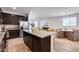 Beautiful kitchen featuring granite countertops, stainless steel appliances, and dark wood cabinetry at 17580 W Country Club Ter, Surprise, AZ 85387