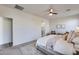 Spacious main bedroom with en-suite bathroom, ceiling fan, and lots of natural light at 17580 W Country Club Ter, Surprise, AZ 85387