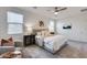 Inviting main bedroom featuring a soft rug, stylish furniture, and plenty of natural light at 17580 W Country Club Ter, Surprise, AZ 85387