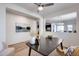 Office space featuring a dark wood table, neutral decor, and art on the walls at 17580 W Country Club Ter, Surprise, AZ 85387