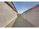 Narrow side yard featuring low-maintenance gravel landscaping at 17580 W Country Club Ter, Surprise, AZ 85387