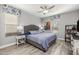 Comfortable bedroom featuring a queen bed, wood-style floors, and gray walls at 18068 E Curva De Plata --, Rio Verde, AZ 85263