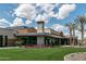 Modern clubhouse featuring stone accents and an open patio with colorful flowers at 18068 E Curva De Plata --, Rio Verde, AZ 85263