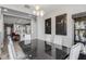 Modern dining room with a view of the open concept kitchen and decorative pendant lighting at 18068 E Curva De Plata --, Rio Verde, AZ 85263