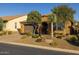 Attractive home with desert landscaping including mature trees and shrubs with pavers on the driveway at 18068 E Curva De Plata --, Rio Verde, AZ 85263