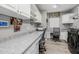 Spacious laundry room with white cabinets, countertops, washer, dryer, and desk area at 18068 E Curva De Plata --, Rio Verde, AZ 85263