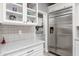 Pantry with ample shelving and stainless steel refrigerator at 18068 E Curva De Plata --, Rio Verde, AZ 85263