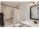 Clean bathroom featuring a shower with a curtain and vanity with a bright, light-colored counter top at 18624 N 92Nd Dr, Peoria, AZ 85382